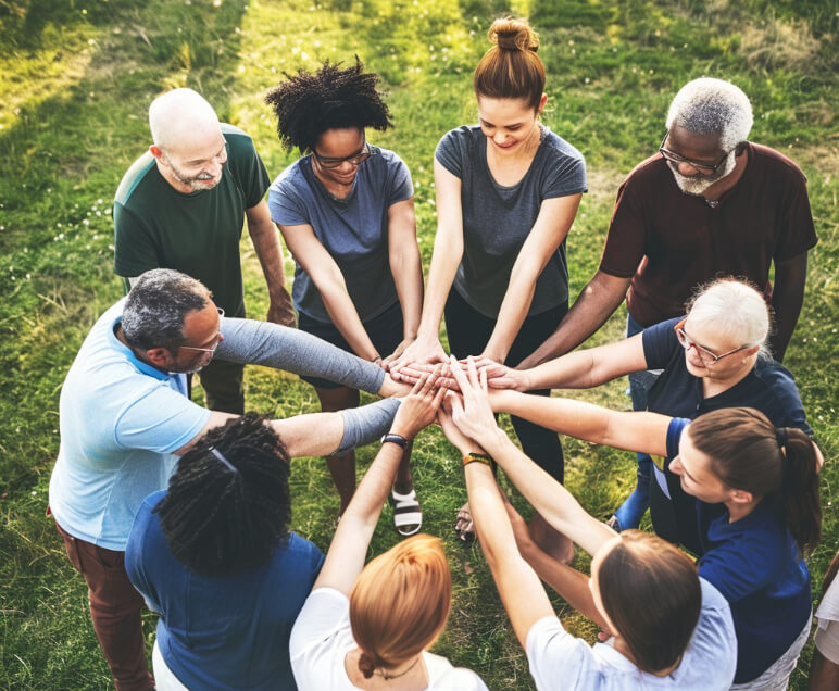 Image of people in circle holding hands - Michael Mut LMSW